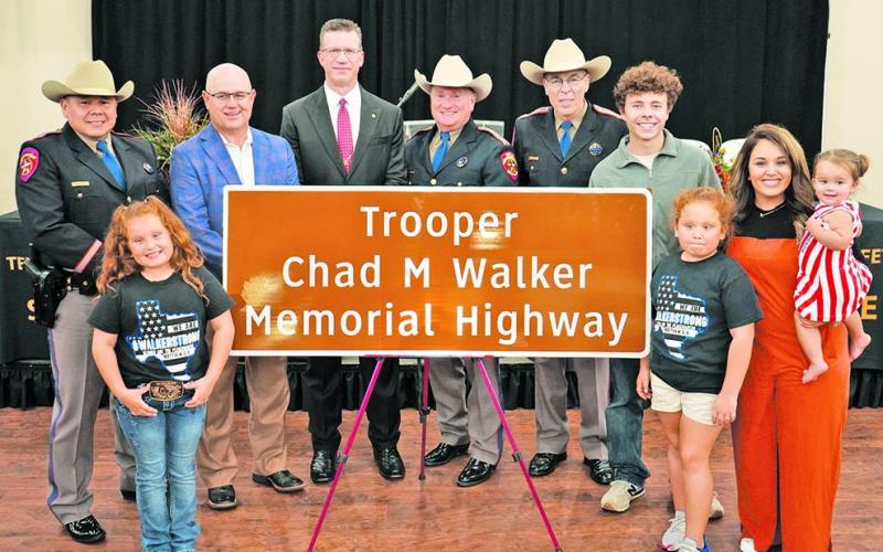 (in no particular order) Major Ruben Galindo; Texas State Rep. Kyle Kacal; Central Texas Regional director, Todd Snyder; Deputy Director, Freeman Martin; Texas DPS Director, Steven McCraw; and the family of the late Trooper Chad Walker; his wife, Tobie; son, Ethan; twin daughters, Rylee and Charlee; and Tulsa June with the newly dedicated Highway Memorial sign in honor of Trooper Walker on Tuesday, Nov. 8.
