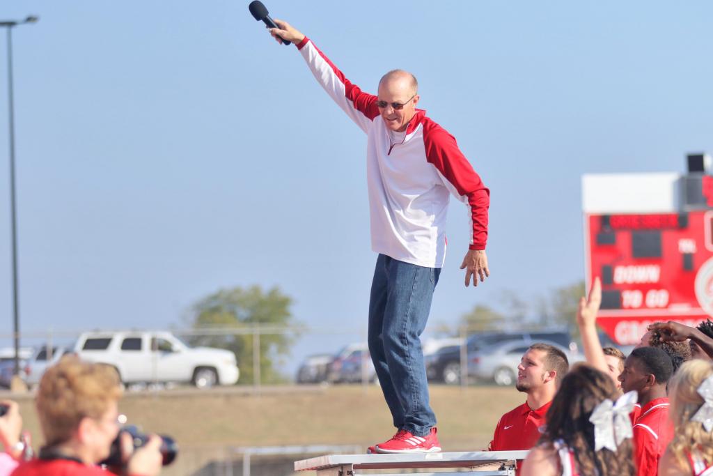 Coach Sloan hyped up all the students at the campus-wide Homecoming Pep-Rally, calling on each school individually to shout out their battle cries before jumping backward into a sea of GHS Varsity Football players who caught him crowd-surf style. Angela Crane photo