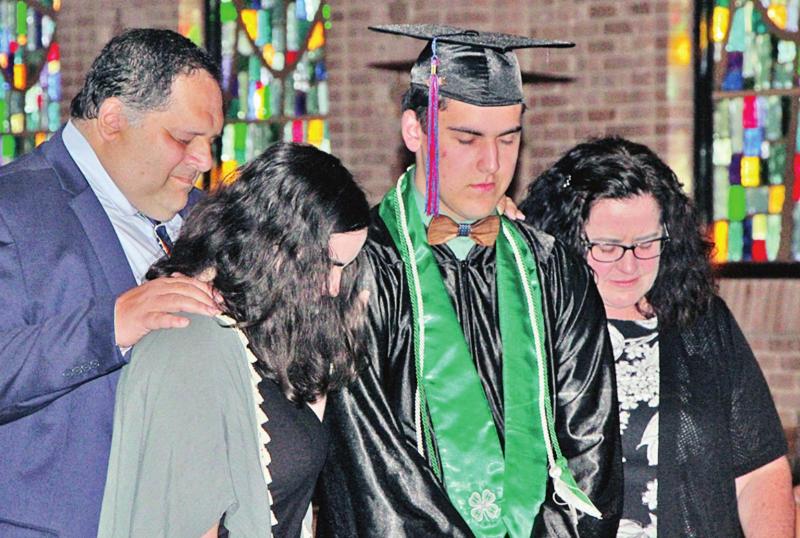 After the diplomas were distributed to all six homeschool graduating seniors on Sunday, June 6, they stood together with their respective families for prayer at the front of First Baptist Church, Fairfield. Shown here is graduate Isaac Lewis, of Thornton, Two Thornton homeschoolers graduate