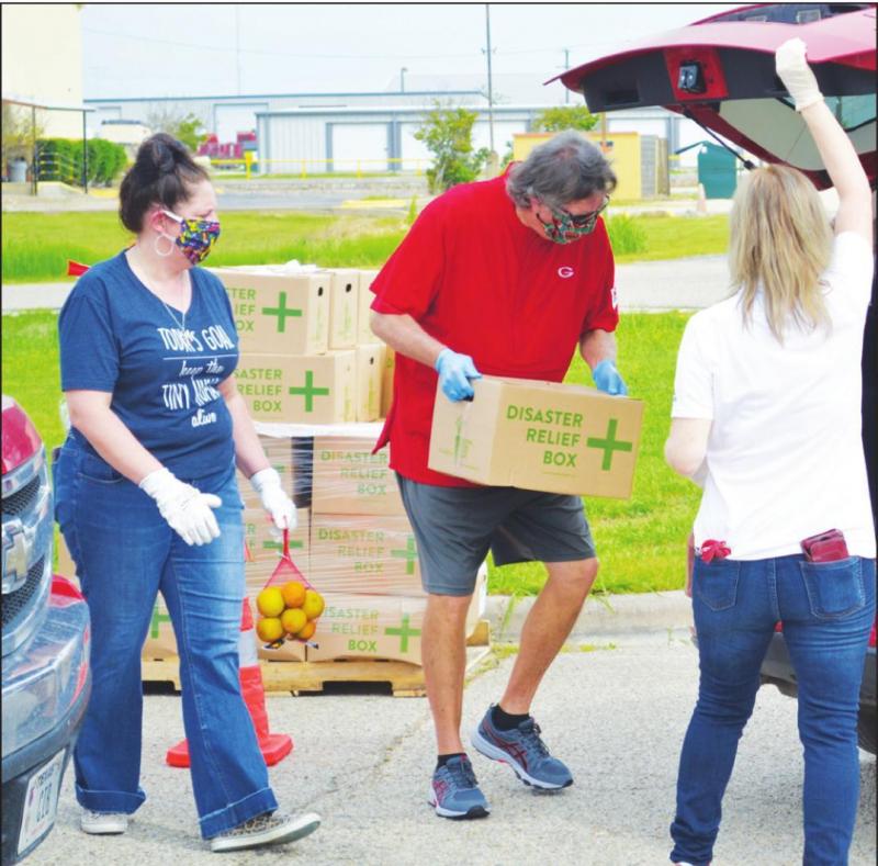 Groesbeck Athletic Director, Jerry Bomar is pictured working during the food distribution coordinated by Groesbeck ISD, the Groesbeck Police Department and Central Texas Food.