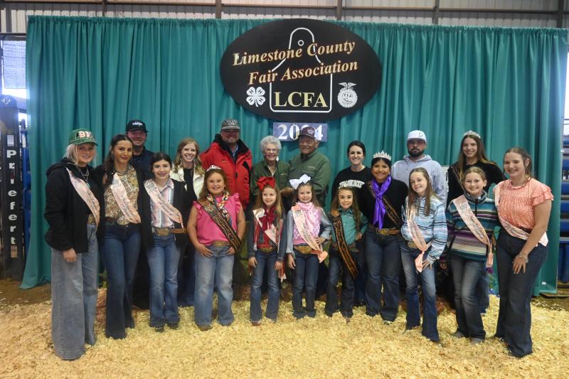 The LCFA and Fair Queens/runner-ups with Arnold and Penny Gray at the Limestone County Fair on Friday, March 22. ‘The Grays’ are a power couple that loves the Fairgrounds and brings smiles to the youth of our county  - The 2024 Limestone County Fair and Livestock Show was dedicated toward The Grays. Mitchell Pate photo.