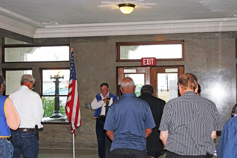 Post Commander Russ Foster and members of the community bow their heads in prayer on Monday, May 26 at the Memorical Day Ceremony at Limestone County Courthouse. 