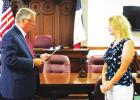 Limestone County Commissioner approved the appointment of Deborah Gerrard to Emergency Services District #2 Board; pictured Judge Richard Duncan is swearing in Gerrard. Alexandra Cannon photo. Commissioners approve indexing of real property records