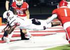LEFT: Mexia running back Tray Jones dives into the end zone for a 3-yard touchdown run to start the scoring in the Blaccats’ 40-28 district victory at Van on Friday night. Photos by Skip Leon/The Mexia News Article Image Alt Text