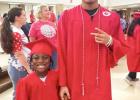 Ombry Jones and his little brother Channyce pose for a photo in their cap and gown. Photo Submitted by Kamesha Jones Ombry Jones and his little brother Channyce pose for a photo in their cap and gown. Photo Submitted by Kamesha Jones