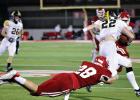BELOW: Groesbeck’s Brenden Morrow (28) dives attempting to tackle Malakoff’s Bryson Adair (22) during a district football game at Groesbeck on Thursday night. State-ranked Malakoff swarms past Groesbeck, 35-0