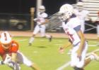 ABOVE: Brylon Jackson makes a diving catch in the fourth quarter on Friday night as the Lions make their way down the field against Kemp. Yellowjackets sting Lions in district opener 48-34