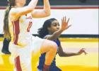 Lady Goat Kennedy Cox prepares to shoot a 2-point shot. The varsity girls’ team faced the Frankston Maidens, narrowly losing 57-51. Cox had five points for the evening. Also pictured is Tia Billingsley. Reginald Ganious photo.