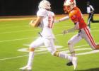 ABOVE: Kaden Adams catches Laramie Greathouse to make a tackle on Friday night. Photo by Mitchell Pate Yellowjackets sting Lions in district opener 48-34