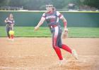 ABOVE: Freshman CJ Carraway pitches for the Lady Goats.