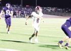 QB Kaden Crawford tosses the ball for a completion, part of an improved performance from the junior gunslinger. Article Image Alt Text