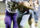 ABOVE: Groesbeck quarterback Allen Lewis evades a Eustace defender and gains yardage during the homecoming game. The freshman signal-caller passed for three touchdowns and ran for two more to spearhead the Goats’ 34-28 victory. Article Image Alt Text