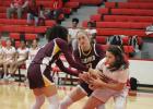 Groesbeck’s Emily Rodriguez, right, pulls the ball away from Fairfield’s Blayke Brackens, left, and Avery Thaler, center, during a game at Groesbeck on Friday, Dec. 15. Fairfield romps to district victory over Lady Goats