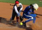 A pickoff throw eludes Groesbeck first baseman Hannah Galvan as a Crockett runner returns to the bag during a game at Groesbeck on Wednesday, March 23. The Lady Goats stomped Crockett, 20-1, in a game stopped after three and a half innings due to the 15-r Slugging Lady Goats pound out two wins in district play