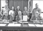PHOTOS BY ALEXANDRA CANNON Limestone County Sheriff Dennis Wilson (back left) and Chief Deputy Murray Agnew (back right) stand with three LCSO dispatchers after County Judge Richard Duncan and Commissioners declared the week of April 14-April 20, 2019 “ Article Image Alt Text