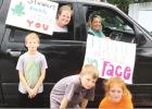 Teachers bring cheer to their students with drive by visits