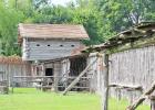 To maintain the historical integrity of Old Fort Parker, repairs to the structure are made with materials that would have been available and utilized by the original settlers, like the cedar planks shown here to replace roofs on two of the four corner bui Old Fort Parker Under New Management