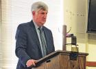 County attorney Herb Bristow reads the resolution on the sale of LCDC to the court, which reflected the sale and operation and management agreement between the county and LaSalle. He praised the efforts of the court and offered his support of the sale. Al Sale of LCDC complete