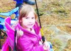 Groesbeck resident Charlotte Cheske enjoys a snack after a long day fishing at Lake Springfield during the Fort Parker State Park Kid Fish event Jan. 28. 