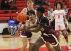Groesbeck’s Braden Ramirez, left, tries to get the ball away from Fairfield’s Airen Roberts (20) during a game at Groesbeck on Friday, Dec. 15. The Goats dropped their District 20-3A opener to Fairfield, 64-33. Fairfield’s 3-pointers too much for Goats in district opener