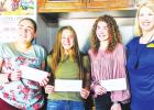 SCHOLARSHIP WINNERS: Right to left, Kara McLelland, Lions Club president, and Lions Club scholarship winners Maggie Devrow, Hannah DeFriend, and Ashleigh Raymond. Contributed photo. Lions Club recognizes scholarship winners