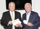 Limestone County Judge Richard Duncan, left, accepts the first of 5,000 face masks from Pete Sessions, right, as a donation from the Lowe’s Foundation Photo by Roxanne Thompson/Groesbeck Journal Article Image Alt Text