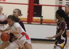 Groesbeck’s Makayla Banks (2) dribbles the ball as Fairfield’s Kaylee Williams defends during a game at Groesbeck on Friday, Dec. 15. Fairfield, the top-ranked team in the state, scored a 59-6 victory in District 20-3A action. Fairfield romps to district victory over Lady Goats