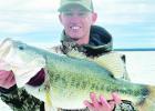 ABOVE: Shelton’s largemouth dwarfed the 13-inch white bass. He estimated its weight at around 10 pounds — a personal best. RIGHT: Fishing guide Justin Shelton of Mabank and his clients were catching crappie, white bass and hybrids on Richland Chambers More Than a Mouthful