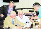 Limestone County resident Garrett Gumm showed County Judge Richard Duncan, Precinct 2 Commissioner Sonny Baker and Precinct 1 Commissioner Bill David a map of the area around LCR 383 during the public hearing Nov. 8. Photo by Katecey Harrell/ The Groesbec Commissioners debate, and table road closure