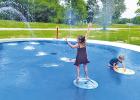 The Splash Pad at Kosse City Park is officially up and running, providing plenty of free, splashing fun for kids of all ages! Pictured are Paisley and Parker Brouillette, enjoying the spray of cool water as the Texas summer heat sets in.  Alexandra Cannon photo/Groesbeck Journal
