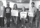 Peace Poster Contest winners present at Lions meeting; speaker talks on immunizations