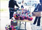 RIGHT: Pictured is Pastor John Carabin readying egg baskets for delivery. Egg handouts went smoothly as families lined blocks to receive the Easter treats Sunday, April 12. The pastor thanked volunteers for their help and the community for recent support.