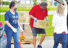 Groesbeck Athletic Director, Jerry Bomar is pictured working during the food distribution coordinated by Groesbeck ISD, the Groesbeck Police Department and Central Texas Food.