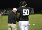 BELOW: Roderick Busby (#50) receives some coaching advice on the sideline of Coolidge's 60-24 win over Parkview Christian. Coolidge cruises to Homecoming victory