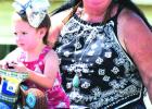 Lakota Martin and her grandmother, Beth Hewitt, both earned blue ribbons for riding in the parade- Lakota as the Littlest Cowgirl, and Beth as Oldest Cowgirl.