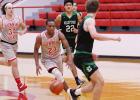 ABOVE: Groesbeck’s Bryan Davis (24) dribbles between Clifton defenders as teammate Aaron Tyus (34) follows the play during a game at the Groesbeck High School gym Friday. Clifton defeated the Goats, 63-29. Lady Goats will seek first win after Thanksgiving break