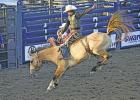 Tripp Burleson, who will be a senior at Groesbeck High School, competes in the saddle bronc riding competition at the 96th Annual Mexia Rodeo on Thursday night, June 25. Photo by Mitchell Pate/Groesbeck Journal