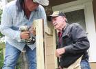 (left) Volunteer Daniel Lima, left, uses a power tool to attach a screw to a ramp he and others were building at a home in Groesbeck on Saturday, May 8, while Edwin Smith looks on. Contributed photos by Gael McKeever Volunteers build ramp for Groesbeck resident