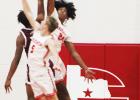 Groesbeck’s Avrian Ray (24) and Chris Cox (5) defend against a Fairfield player during a game at Groesbeck on Friday, Dec. 15. Photo by Skip Leon/The Groesbeck Journal Fairfield’s 3-pointers too much for Goats in district opener
