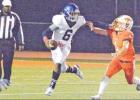 Teague’s Drew Satterwhite chases down all-everything Whitney quarterback Devin Wilson, who finished with 136 yards passing and 224 yards rushing. Photo by Monte Calame Whitney stays unbeaten in district with win over Teague