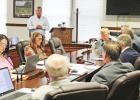 County Sheriff Murray Agnew tells commissioners about the valuable work of volunteer Thayla Tucker regarding rabies control in the county. Article Image Alt Text
