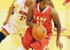 Groesbeck Lady Goat Natleigh Burns (15) dribbles out of trouble as a Diboll defender closes in, during the two teams pool play game at last weekend’s Fairfield Invitational Basketball Tournament. Photo by Stephen R. Farris/Sports Editor Article Image Alt Text