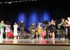 Two brass quintets play their shared ensemble piece at the Spring Concert. Article Image Alt Text