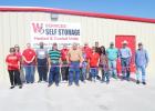 David Winn did the honors of cutting the ribbon in front of his now-open W3 Services Self Storage facility on Friday, September 8, with Groesbeck Chamber of Commerce members looking on. Photo by Alexandra Cannon/Groesbeck Journal