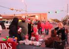 Locals support this year’s senior class by purchasing baked goods from the Groesbeck Chamber of Commerce booth at the city holiday celebration on Saturday, Dec. 2. Article Image Alt Text