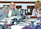 Limestone County Commissioner Pct. 4 John McCarver responds to Sheriff Dennis Wilson’s plea to commissioners court to allow him to continue to work with attorney George Hyde in dealing with issues at the County Jail. McCarver wants the county to designate the law firm of Naman, Howell, Smith and Lee to represent Limestone County in all its legal work. Also shown are County Clerk Peggy Beck, at front, and County Auditor Debbie Watson, at rear. Photo by Roxanne Thompson/The Groesbeck Journal
