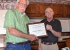 Lions Harvey Fredriksson is presented his certificate and pen for beginning a named a life member of the Texas Lions Camp. Jim Bohls, who made the presentation, is also pictured. Journal photo/Tom Hawkins