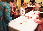 Parents and library employees helped kids with craft time, where they colored and created Rudolph the Reindeer headbands, complete with antlers and a red nose! Photo by Alexandra Cannon/Groesbeck Journal