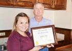 Ashley Foy is presented a certificate for being named Lion of the Year for 2016-2017. Making the presentation is Shawn Harkin, immediate past president. The honor included a Life Membership to the Texas Lions Camp in Ashley’s name. Journal Photo/Tom Hawkins