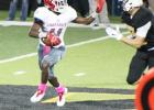 Goat running back Stanzley Gibson works to move past a Malakoff defender, during Groesbeck’s district game with the Tigers. Photo by Melissa Smith/Special to The Groesbeck Journal